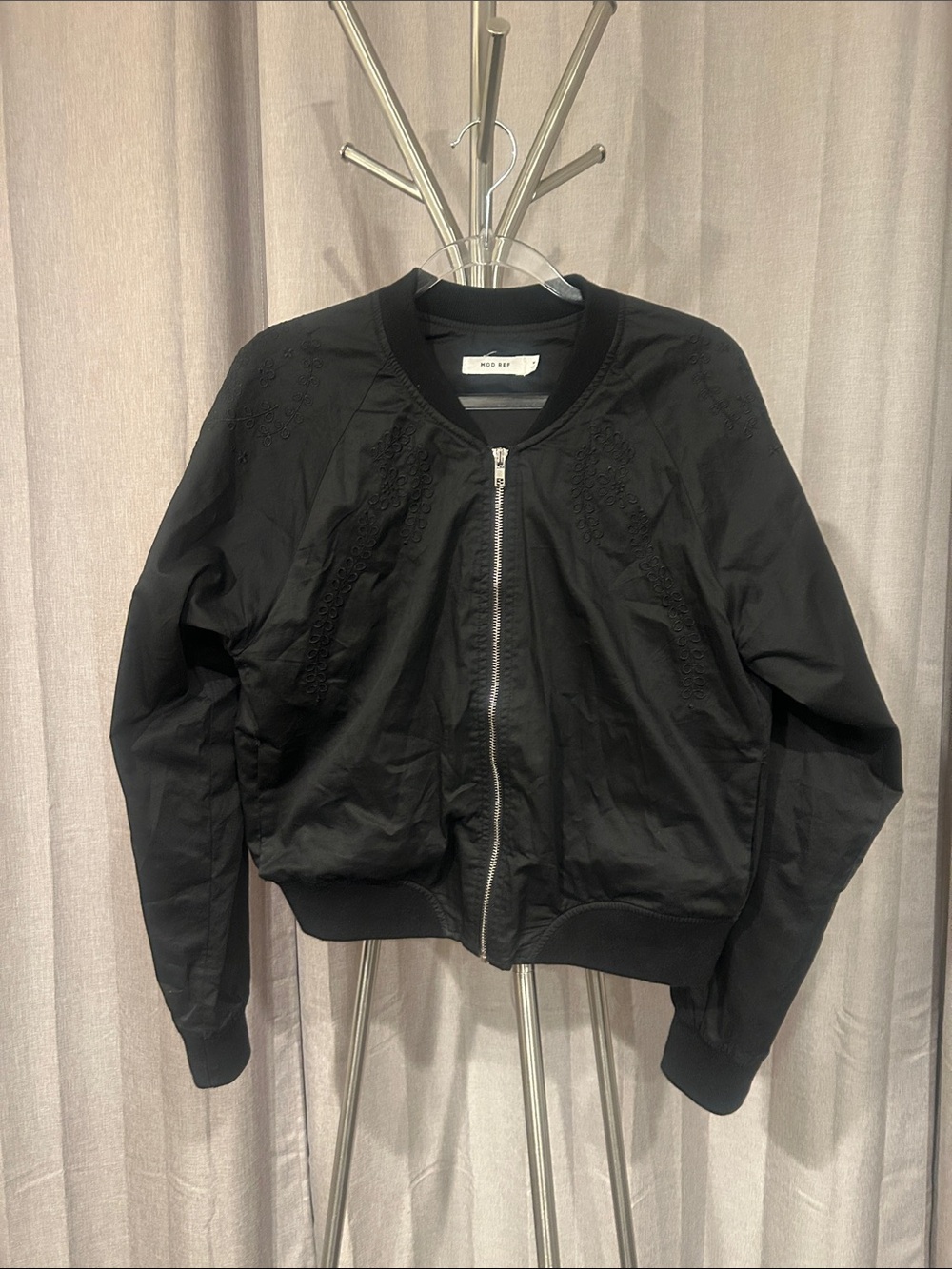 Mod Ref Black Ribbed Collar Bomber with embroidery details. 100 percent cotton.